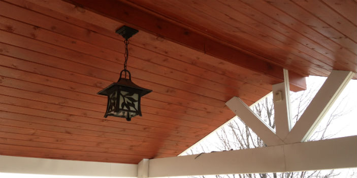 Covered porch with treated wood ceiling in Hoskins, NE