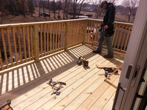 Treated second story walkout wood deck in Norfolk, NE
